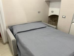 Postel nebo postele na pokoji v ubytování L’angolo in piazza
