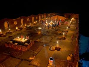 an overhead view of a lit up area with candles at Camp Desert Bivouac Chegaga in El Gouera