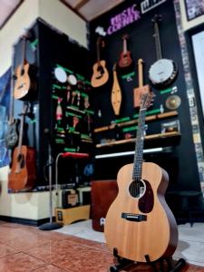 a guitar on display in a guitar shop at Slow Monkey Hostel in Santa Teresa Beach