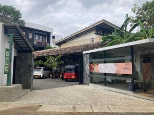 a building with a sign in the front of it at Handagedara Resort & Spa in Mirissa