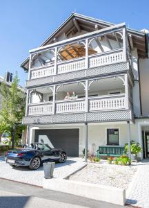 a car parked in front of a house at Refugium Bad Ischl in Bad Ischl