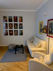 a living room with two couches and a table at Casa Gregis - Museums Area - 10 min walk to Upper town in Bergamo