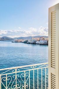 a view of the water from a balcony at Seaside Serenade 1, suite in Ermoupoli