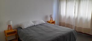 Кровать или кровати в номере Dpto Residencial