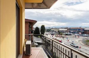 a balcony with a view of a city street at Formigine - [Motor Valley-Homes] in Formigine