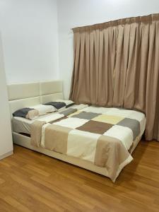 a bedroom with two beds and a window at Sekinchan Simple LoveSea House ~ Seaview 3-14AB in Sekincan