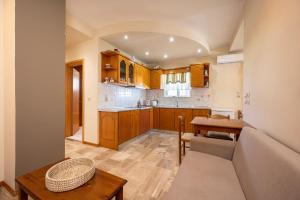 a kitchen with a couch and a table in a room at Panorama Studios in Mastihari