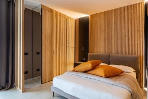Postel nebo postele na pokoji v ubytování La Pergola Suites