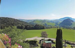 a view of a green field with trees and mountains at Awesome Apartment In Ertl With Wifi in Buchschachen