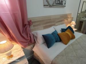 Postel nebo postele na pokoji v ubytování B&B A Modo Mio