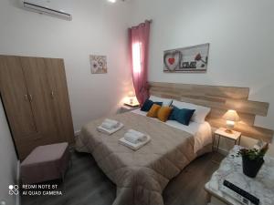 Postel nebo postele na pokoji v ubytování B&B A Modo Mio