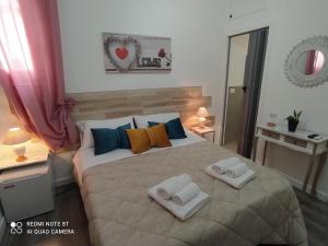 Postel nebo postele na pokoji v ubytování B&B A Modo Mio