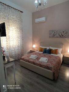 Postel nebo postele na pokoji v ubytování B&B A Modo Mio