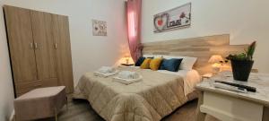 Postel nebo postele na pokoji v ubytování B&B A Modo Mio