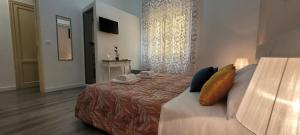 Postel nebo postele na pokoji v ubytování B&B A Modo Mio
