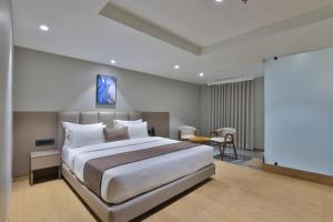 Katil atau katil-katil dalam bilik di Hotel Shivashish