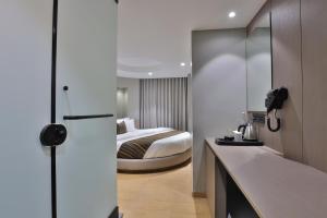 Katil atau katil-katil dalam bilik di Hotel Shivashish