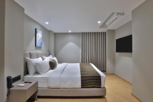 Katil atau katil-katil dalam bilik di Hotel Shivashish