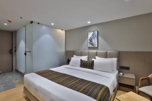 Katil atau katil-katil dalam bilik di Hotel Shivashish