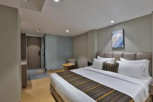 Katil atau katil-katil dalam bilik di Hotel Shivashish