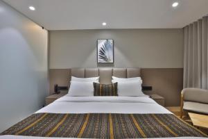Katil atau katil-katil dalam bilik di Hotel Shivashish