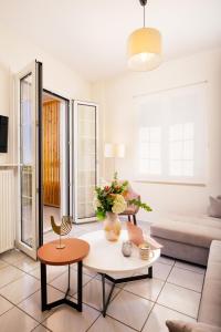 a living room with a couch and a table at Olive Garden Residence in Platanes