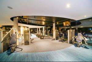 a gym on a cruise ship with tread machines at Tambuli Seaside Resort Residences in Lapu Lapu City