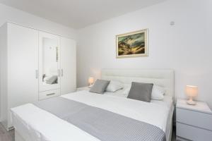 Posteľ alebo postele v izbe v ubytovaní Apartment Dupčić