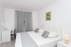 Posteľ alebo postele v izbe v ubytovaní Apartment Dupčić