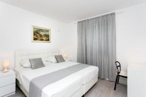 Posteľ alebo postele v izbe v ubytovaní Apartment Dupčić