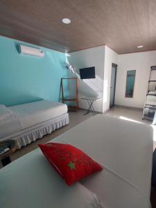 Postel nebo postele na pokoji v ubytování Hotel Carlota Tamarindo