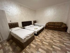 Letto o letti in una camera di Baron Hotel