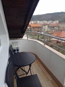 a table and chairs on a balcony with a view at Apartment Kirili and Metodi 41 - 8 С in Berkovitsa