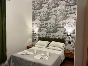 A bed or beds in a room at Les Artes