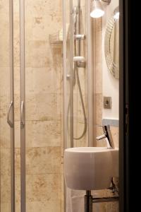 a bathroom with a sink and a shower at Palazzo Giorgi in Siena