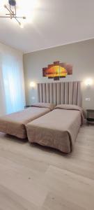 Voodi või voodid majutusasutuse Hotel Everest Arco toas