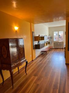 a living room with a wooden floor and a table at Cà Torre apartment in Mestre
