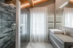 a bathroom with a sink and a shower at Borgo degli Ulivi in Formigine +105 photos