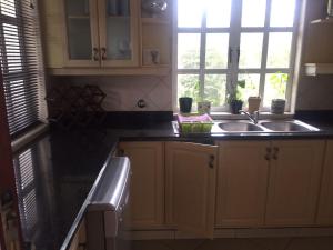 a kitchen with a sink and a counter top at Lyndhurst 7 in Margate