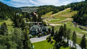 an aerial view of a house in the mountains at Pensjonat Pod Długą Polaną in Nowy Targ
