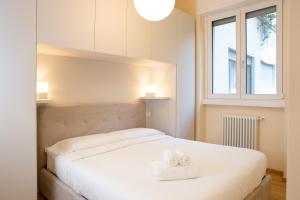 Ліжко або ліжка в номері Botero Luxury Apartment Vicino Arco della Pace