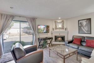 a living room with a couch and a fireplace at Boston Commons - 1143 in Greenwood Village