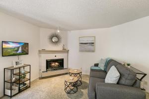 a living room with a couch and a fireplace at Boston Commons - 1263 in Greenwood Village