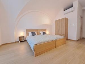 Postel nebo postele na pokoji v ubytování la casa sull arco