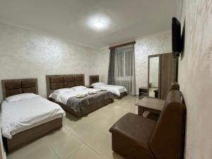Letto o letti in una camera di Baron Hotel