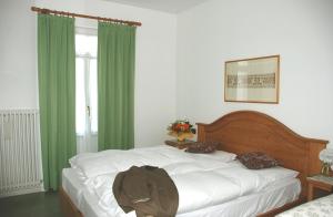 Łóżko lub łóżka w pokoju w obiekcie Hotel Oasi