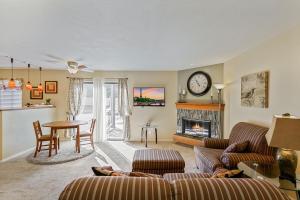 a living room with a couch and a fireplace at Boston Commons - 1167 in Greenwood Village