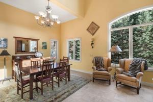 a dining room with a table and chairs at 1558 Hinkson Terrace in Ouray