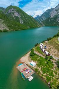 an aerial view of a lake with a group of boats at 5 Stinet in Koman