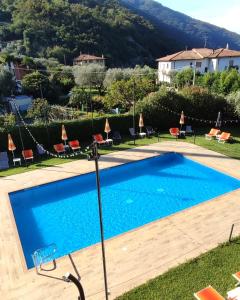 a swimming pool in the yard of a villa at Hotel Everest Arco in Arco